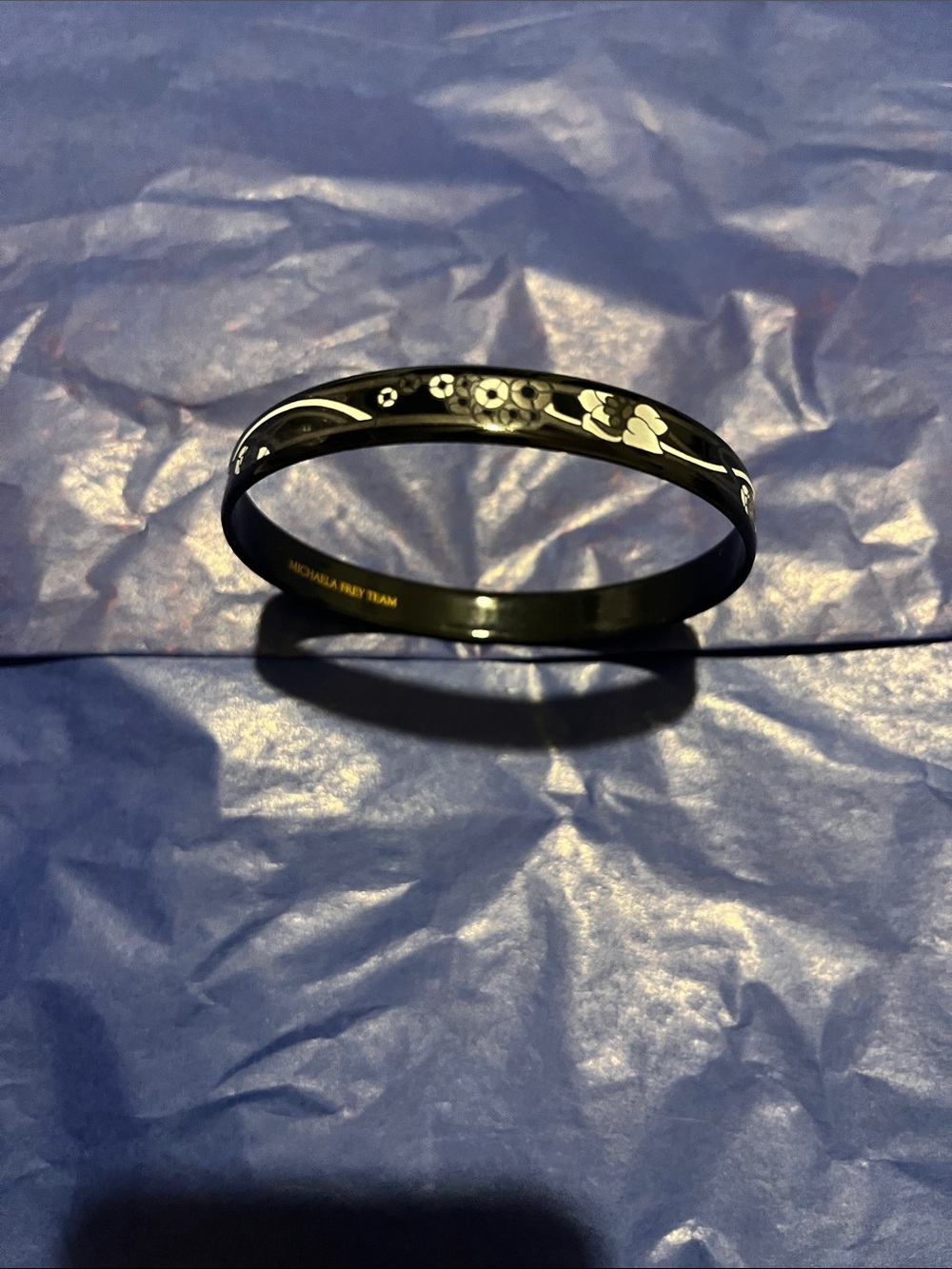 Michaela Frey Team Black Floral Accent Bangle Bracelet with Gold Logo - Picture 7 of 8